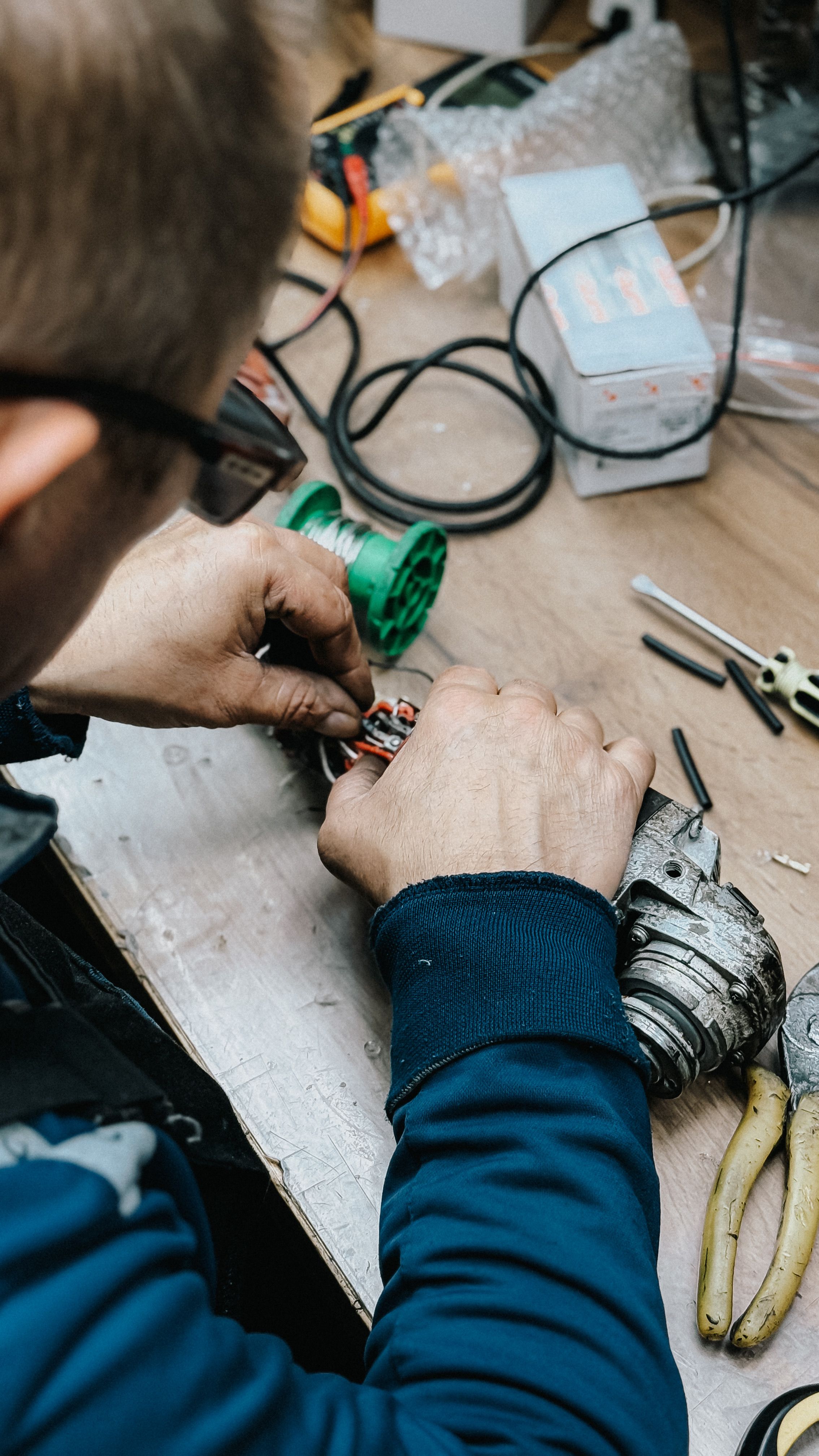 Electrician checking a circuit with test leads