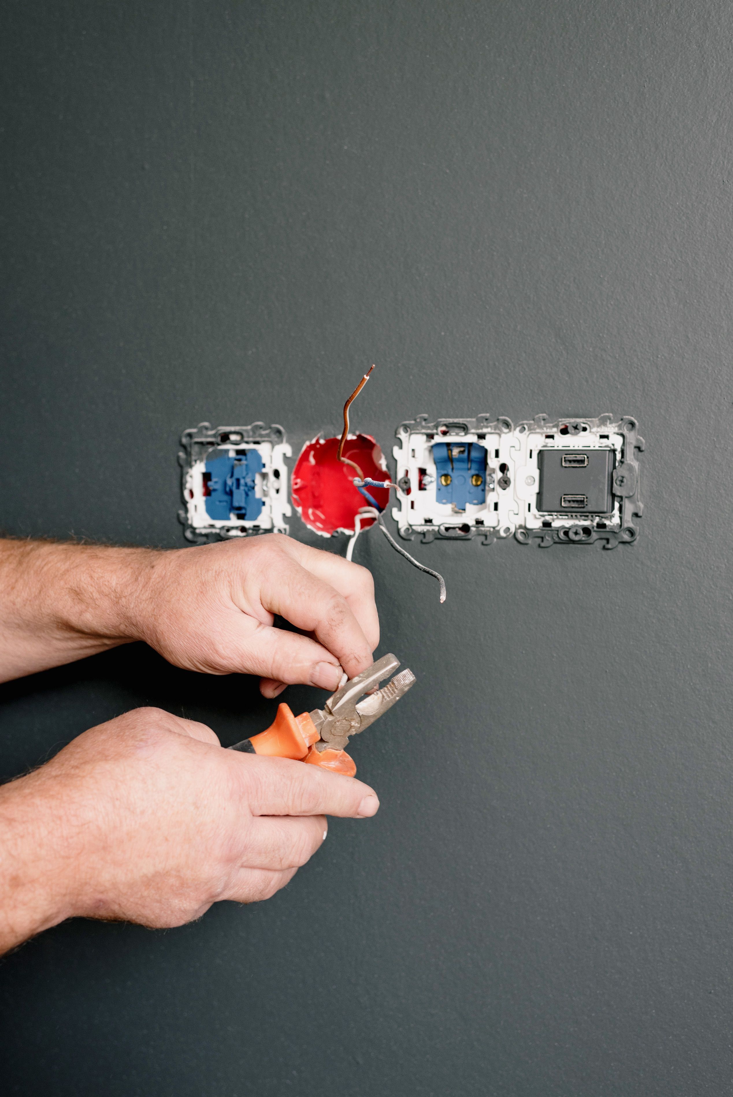 Hand tool beside wall sockets